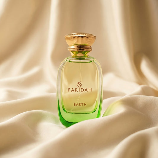 Earth - The Elements Collection Faridah luxury non-alcoholic perfume in green bottle on silk