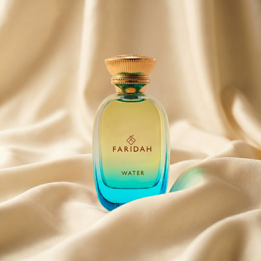 Water - The Elements Collection Faridah luxury non-alcoholic perfume in aqua-blue bottle on silk