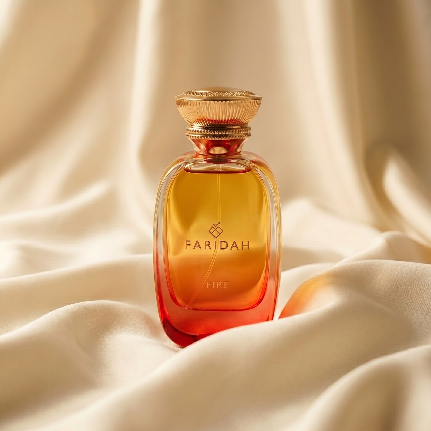 Fire - The Elements Collection Faridah luxury non-alcoholic perfume with amber-gold bottle on silk