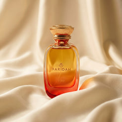 Fire - The Elements Collection Faridah luxury non-alcoholic perfume with amber-gold bottle on silk