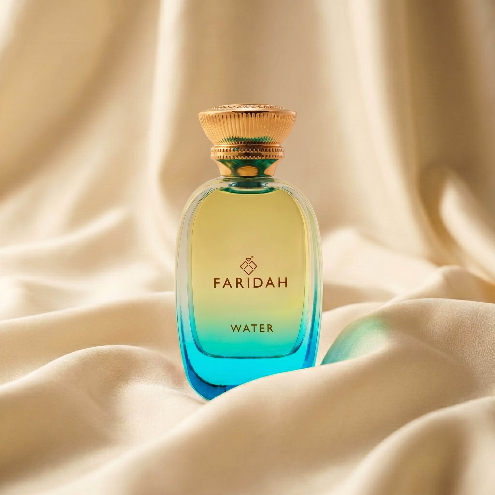 Water - The Elements Collection Faridah luxury non-alcoholic perfume in aqua-blue bottle on silk
